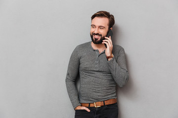 Sticker - Portrait of a handsome casual man talking on mobile phone