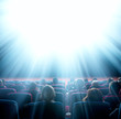 viewers look at shining light in the cinema