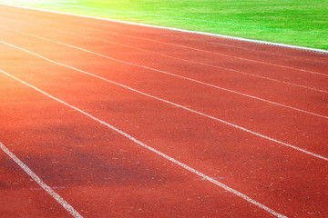 Red running track, white line in the stadium