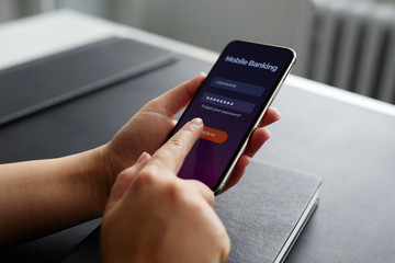 Wall Mural - female hands using mobile banking on smartphone