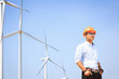 © Cheangchai - Engineers are investigating the wind turbine.