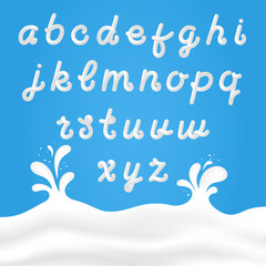 Milk font with latin letters. White milk hand drawn alphabet with liquid letters on background with milk splashes