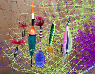 float and baits on a fishing net background