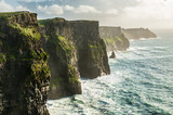 Fototapeta Uliczki - The Cliffs of Moher, Irelands Most Visited Natural Tourist Attraction, are sea cliffs located at the southwestern edge of the Burren region in County Clare, Ireland.