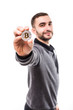 © F8  \ Suport Ukraine - Young handsome man pointed golden bitcoin on camera isolated on white background