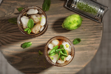 Poster - Two glasses of Cuba Libre cocktail on wooden table