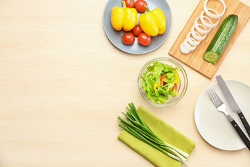 Wall Mural - Composition with vegetable salad and ingredients on table