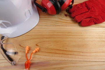 Wall Mural - HEALTH AND SAFETY CONCEPT. Personal protective equipment on wooden table background. Copy space