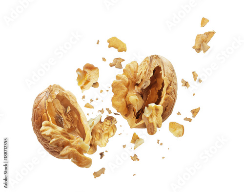 Fotomural Walnut is torn to pieces on white background