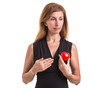 © SKT Studio - Love heart, protect and healthcare concept : Caucasian woman holding red heart on her chest and heart position isolated on white