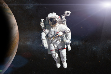 Wall Mural - astronaut in outer space on background of the planet. elements of this image furnished by nasa.