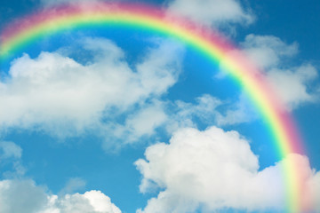 Wall Mural - rainbow in blue sky.