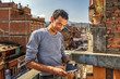 Man Checks his Smartphone, Panauti, Nepal
