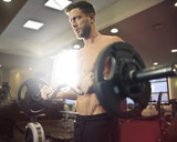 Fototapeta Panele - Weights lifting at the gym
