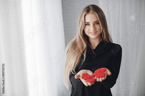 Fotografie, Obraz Young beautiful woman with a nice smile,a blonde with long straight hair,spends
