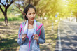 © geargodz - sporty woman with white towel resting after workout sport exercises outdoors at the park