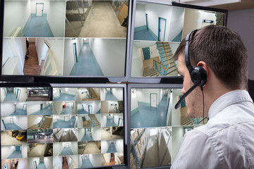 Aufkleber - Operator Looking At Multiple Camera Footage On Computer