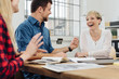 © contrastwerkstatt - Happy motivated business team enjoying a laugh