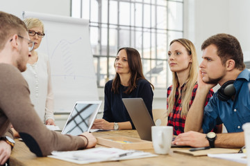 Poster - Dedicated business team discussing a project