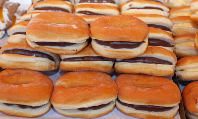 Wall Mural - Tasty donut stuffed with chocolate in a pastry shop