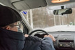 © YuSafa - An elderly man is sitting at the wheel of a car.