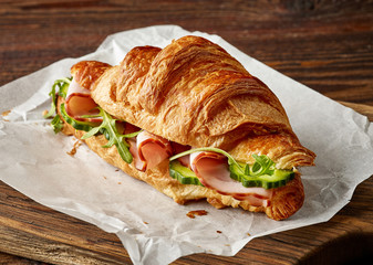 Wall Mural - Croissant sandwich with cucumber and ham