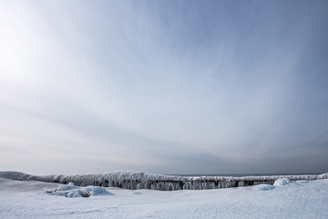 Wall Mural - Breakwall Covered with Ice