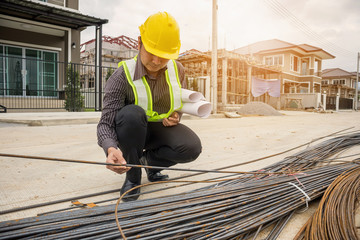 professional engineer worker at the house building construction site