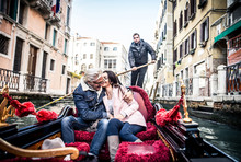 Couple Sailing On Venetian Gondola