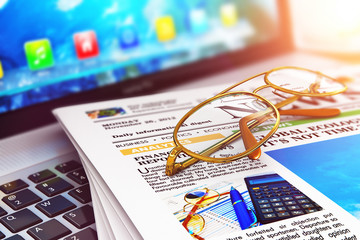 Poster - Stack of newspapers on laptop and eyeglasses