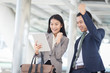 © chompoo - Two businesspeople showing their gladness, Successful work concept.