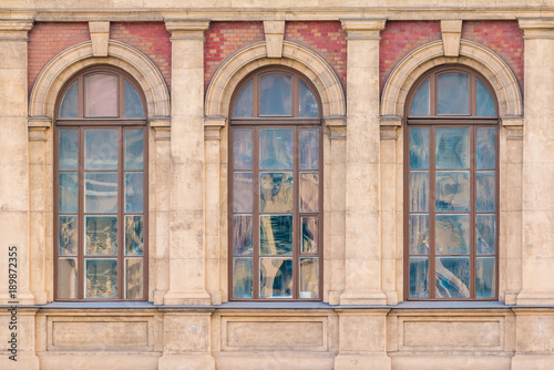 Three Windows In A Row On The Facade Of Urban Historic Three Windows In A Row On The Facade Of Urban Historic