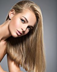 Wall Mural - Beautiful young woman with long  straight  hairs