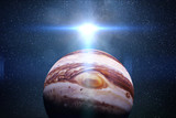 Fototapeta  - sunrise over planet Jupiter with the Sun and the stars of the galaxy 