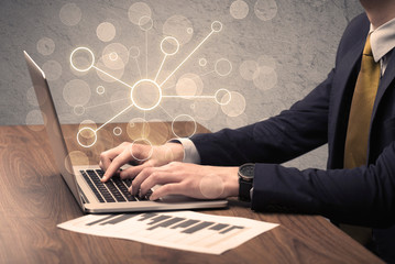 Science worker typing on laptop computer