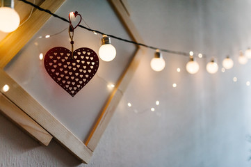 Red heart on background old wood picture and bulbs light. love bokeh. Valentines day.