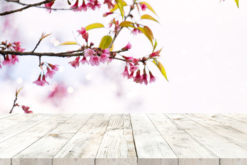 Wall Mural - top of wood table empty ready for your product and food display or montage with pink cherry blossom 