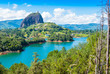 Colombia Guatape,  landscape view of Penol lake and the famous homonym big rock in a sunny day with blue sky a famous tourist destination