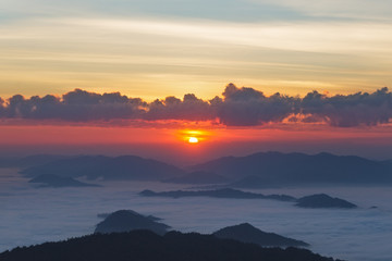 Amazing sunrise sunset.Natural Sunset Sunrise Over Mountain and fog. Bright Dramatic Sky And Dark Ground.Colorful sky in the sunset sunrise.