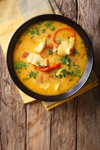 Brazilian Food: Moqueca Baiana Of Fish And Bell Peppers In Spicy Coconut Sauce Close-up On A Plate. Vertical Top View