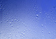 © Jane_S - Glass blue texture with water drops on a blue background