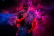 © Grispb - A man smokes an electronic cigarette. The man in the smoke. bearded man vaping. Men with beard in sunglasses vaping and releases a cloud of vapor. vaping man holding a mod. A cloud of vapor.