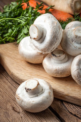 Fresh mushrooms on cutting board.