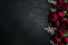 Burgundy Or Wine Red Roses And Silver Decor On Dark Background. True Love Passion And Desire. Copy Space Concept