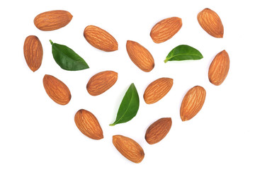 almonds in the shape of a heart with leaves isolated on white background. Top view. Flat lay pattern