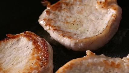 Wall Mural - Frying slices of pork muscles meat on pan with oil