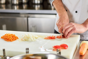 Vegetables chopping, piles of chopped vegetables. Red bell pepper chopping, chopped bell pepper. Vegetables dicing.