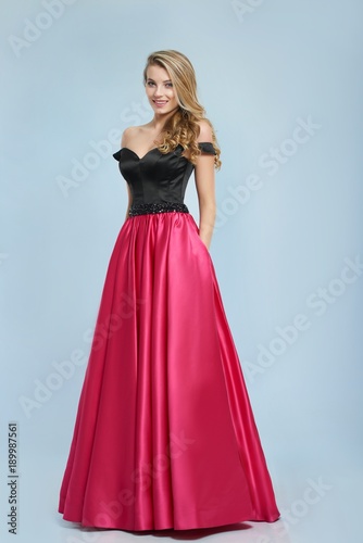 Beatiful Girl With Curly Blonde Hair Stands In Amazing Evening