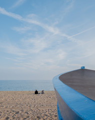 persons with boat in beach