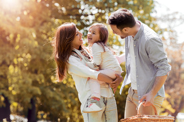 Wall Mural - Happy joyful young family.